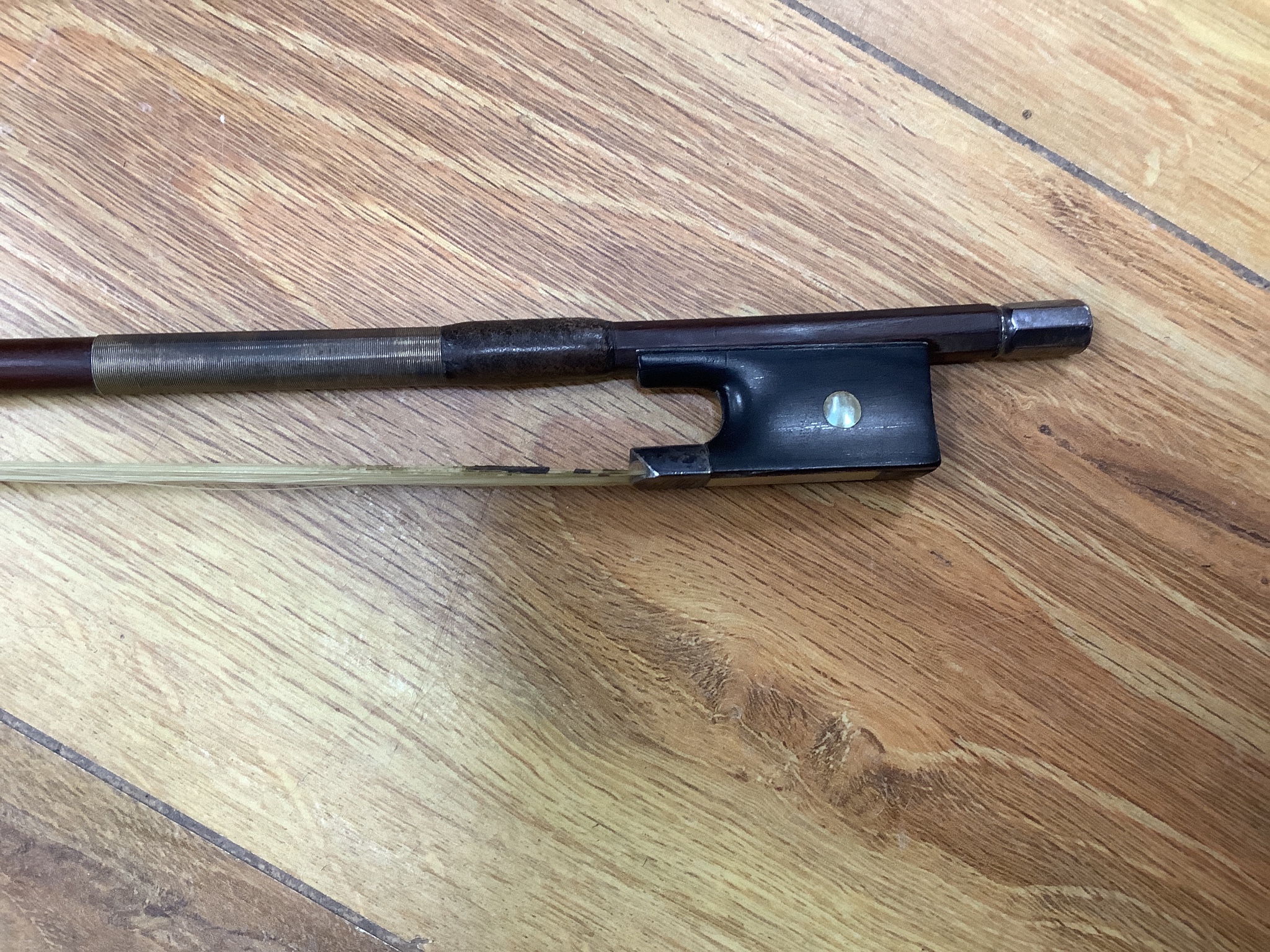 A cased violin and bow